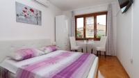 Postel nebo postele na pokoji v ubytování Apartments Villa Flamingo