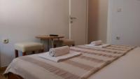 Posteľ alebo postele v izbe v ubytovaní Apartmani Dina
