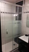 a glass shower in a bathroom with a sink at Appartement 4 pers Saint Gervais les Bains in Saint-Gervais-les-Bains