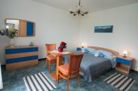 Posteľ alebo postele v izbe v ubytovaní Apartments & Rooms Ribarić
