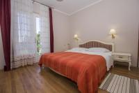 Posteľ alebo postele v izbe v ubytovaní Apartments & Rooms Ribarić
