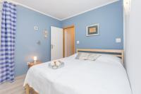 Postel nebo postele na pokoji v ubytování Apartman Karmen