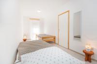 Postel nebo postele na pokoji v ubytování Apartman Karmen