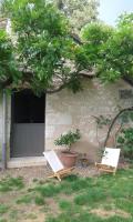 two lawn chairs sitting in front of a house at la vigneraie in Seigy