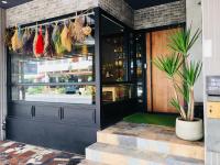 a store front with a potted plant in front of it at Book 5 in Dongshan