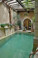 a swimming pool in a backyard with a pergola at Un Mas en Ville in Marseille