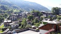 a small village in the mountains with houses at Appartement 4 pers Saint Gervais les Bains in Saint-Gervais-les-Bains