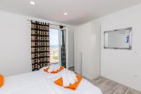 Postel nebo postele na pokoji v ubytování Apartments A&M