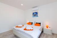 Postel nebo postele na pokoji v ubytování Apartments A&M