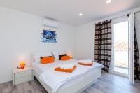 Postel nebo postele na pokoji v ubytování Apartments A&M