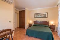 A bed or beds in a room at Apollo B&B