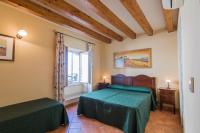 A bed or beds in a room at Apollo B&B