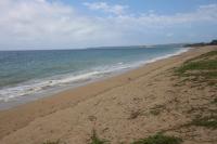 a sandy beach with the ocean in the background at Kenting Waterfront Hotel in Kenting