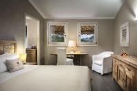A bed or beds in a room at Petra Segreta Resort & Spa