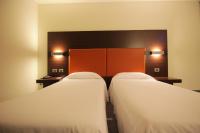 Łóżko lub łóżka w pokoju w obiekcie Hotel Major