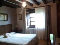 Łóżko lub łóżka w pokoju w obiekcie Hotel Rural Natxiondo