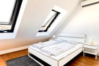 A bed or beds in a room at easy flat Margareten Apartments