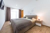 Postel nebo postele na pokoji v ubytování Apartments Villa Elena
