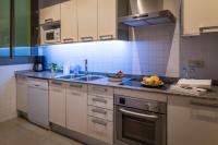 Kuchyň nebo kuchyňský kout v ubytování Habitat Apartments Alibei
