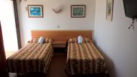 Posteľ alebo postele v izbe v ubytovaní Apartamentos del Rey