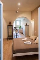 Posteľ alebo postele v izbe v ubytovaní La Bellavita Del Garda Luxury Apartments
