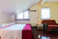 Łóżko lub łóżka w pokoju w obiekcie Apartments Villa Orion