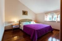 Łóżko lub łóżka w pokoju w obiekcie Apartments Villa Orion