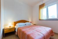 Łóżko lub łóżka w pokoju w obiekcie Apartments Villa Orion