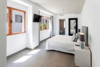 A bed or beds in a room at Ag Casa Del Mar Premium