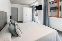 A bed or beds in a room at Ag Casa Del Mar Premium