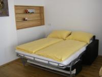 Łóżko lub łóżka w pokoju w obiekcie Penthaus Appartement