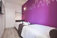 A bed or beds in a room at Habitat Apartments ADN