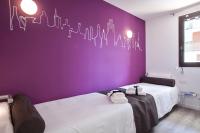 A bed or beds in a room at Habitat Apartments ADN