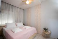 Postel nebo postele na pokoji v ubytování NK Apartments
