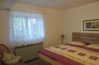 Posteľ alebo postele v izbe v ubytovaní Apartment Petrinic V