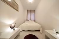 Posteľ alebo postele v izbe v ubytovaní Apartment Luci