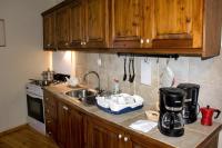 Kuchyň nebo kuchyňský kout v ubytování Nostos Residence - Apartment Terra
