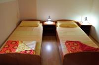 Łóżko lub łóżka w pokoju w obiekcie Apartmani Blaslov