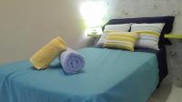 A bed or beds in a room at Apartamentos Oscar