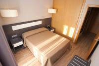 Apartahotel & Spa Jacetaniaにあるベッド