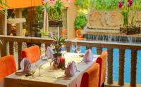 a table set up for a meal in a restaurant at Golden Temple Hotel in Siem Reap