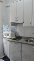 A kitchen or kitchenette at Apartamentos Oscar
