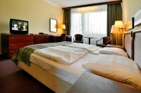Postel nebo postele na pokoji v ubytování Hotel Krakonoš