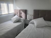Postel nebo postele na pokoji v ubytování Nautico Beach & Golf Alicante