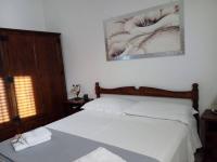 A bed or beds in a room at B&B Lo Scrigno del Salento