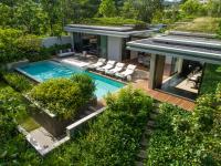 an aerial view of a house with a swimming pool at Rosewood Phuket in Patong Beach