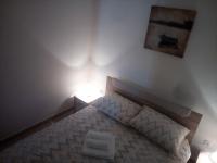 Postel nebo postele na pokoji v ubytování Apartman Pajo