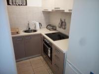Kuchyň nebo kuchyňský kout v ubytování Apartman Pajo