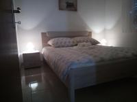 Postel nebo postele na pokoji v ubytování Apartman Pajo