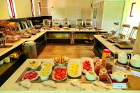 a kitchen with a bunch of food on a table at Oak Ray Elephant Lake in Sigiriya